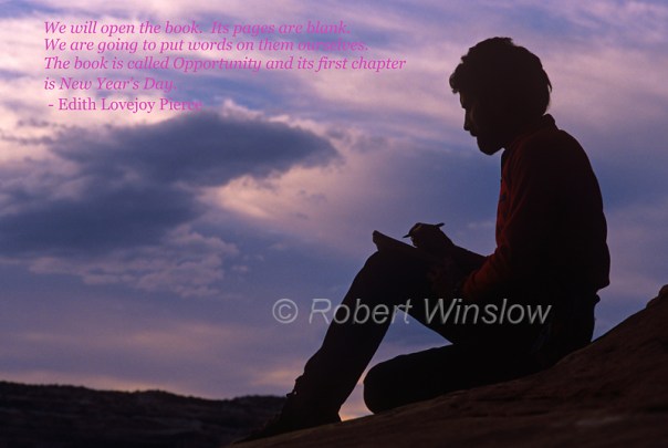 MR, Man writing in a journal in the outdoors